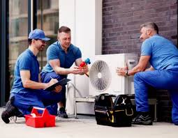 HVAC team discussing an outdoor system inspection